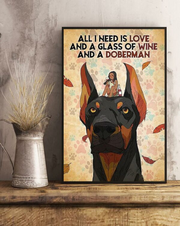 All I need is love and a glass of wine and a doberman poster